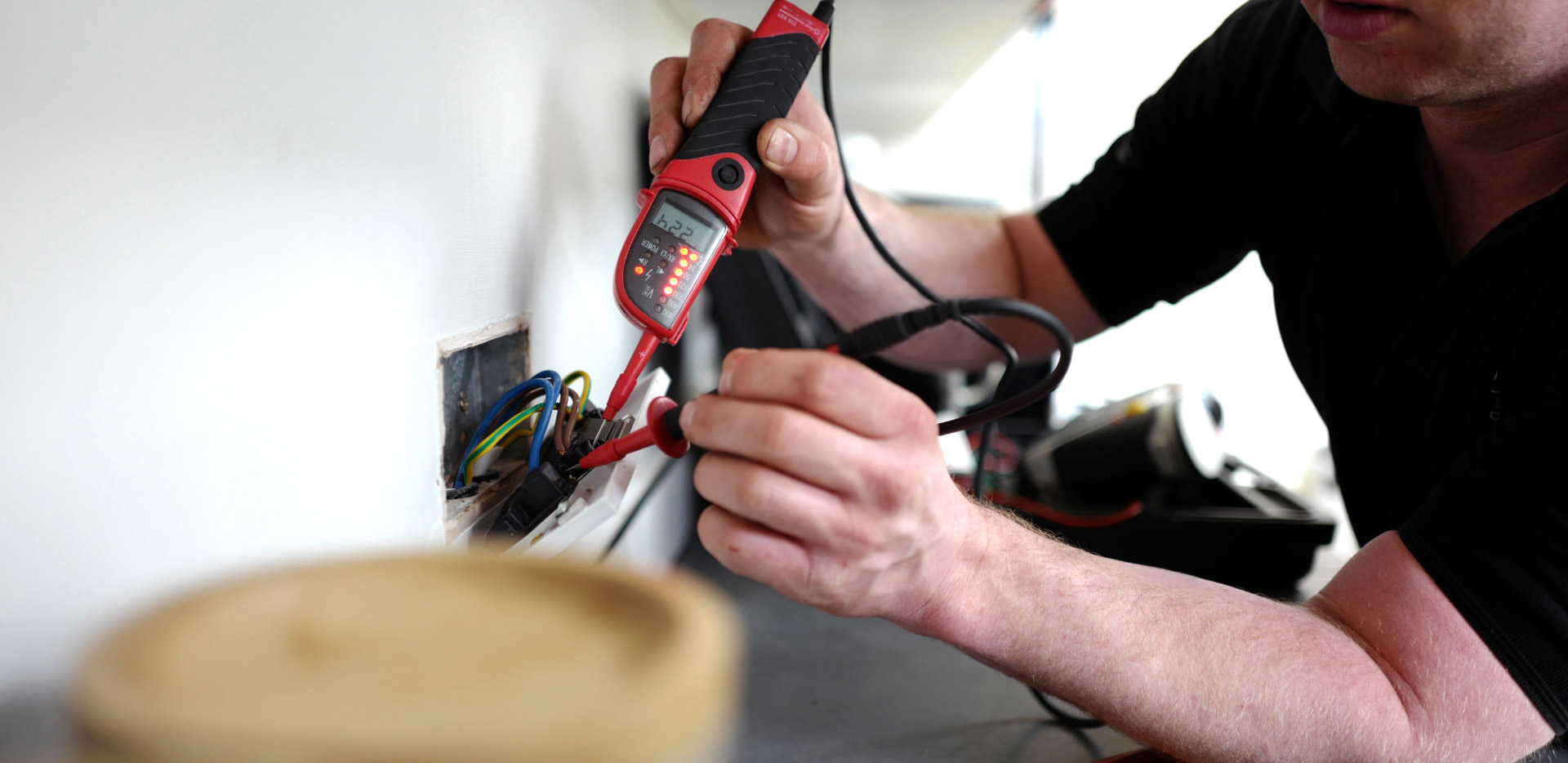 Man testing a plug socket