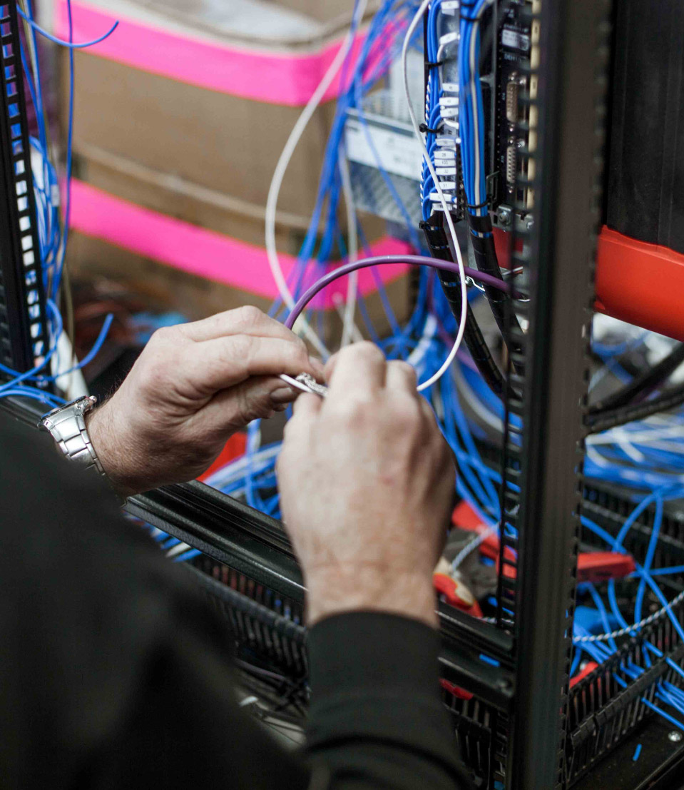 Man clipping some wires together